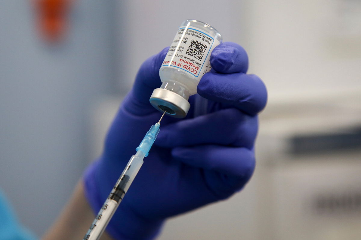 <i>Dinendra Haria/SOPA Images/Sipa USA/AP</i><br/>A health worker draws the Moderna Covid-19 vaccine as she prepares to administer the spring booster also known as fourth jab to a person at a vaccination clinic.