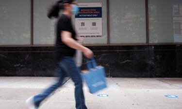 People walk by a health care facility that is administering the monkeypox vaccine by appointment on August 5 in New York City. Both the World Health Organization and the  Biden administration has declared monkeypox a public health emergency as cases on the rise across the US.