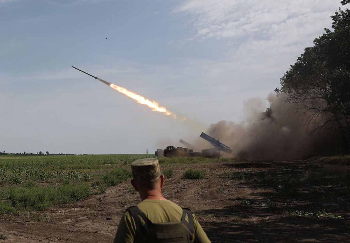 <i>Anatolii Stepanov/AFP/Getty Images</i><br/>Ukrainian artillery unit fires with a BM-27 Uragan