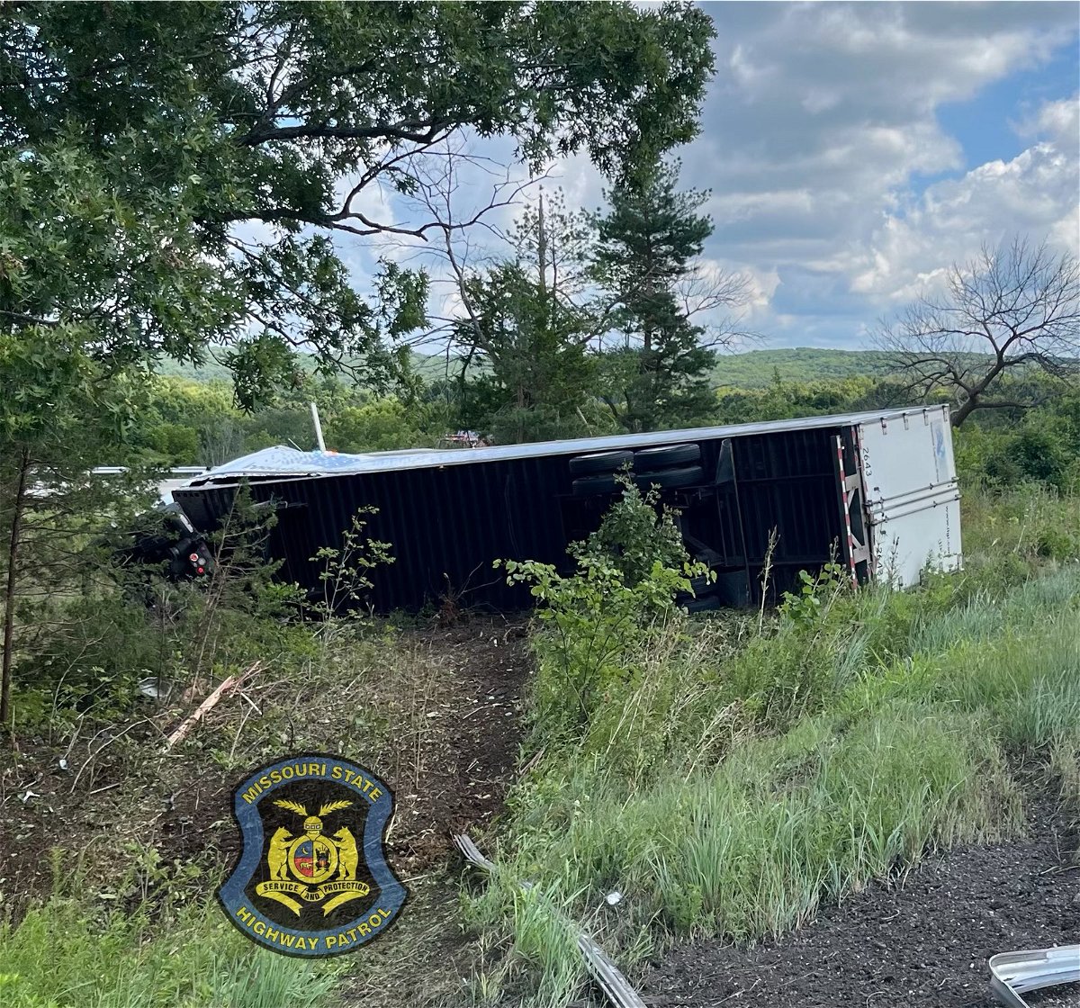 A tractor-trailer sits overturned on the roadside on Interstate 70 in Montgomery County on Monday, Aug. 22, 2022.