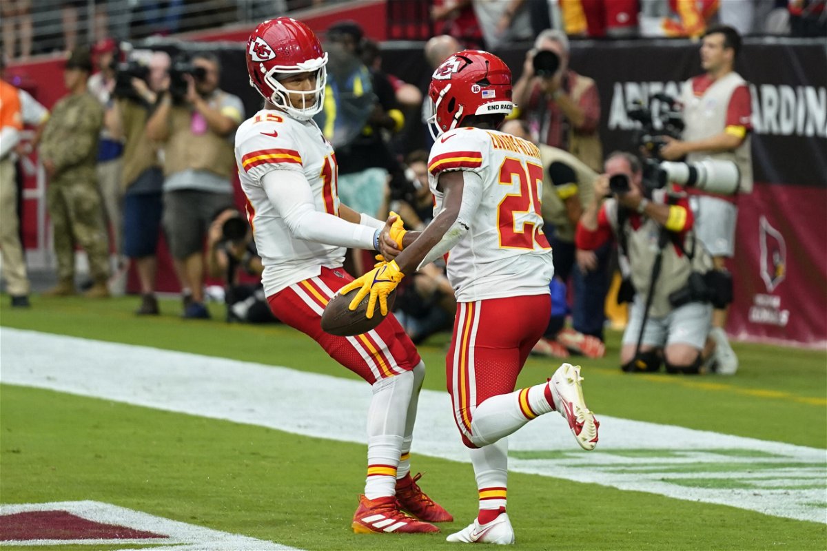 Kansas City Chiefs quarterback Patrick Mahomes, left, celebrates after running back Clyde Edwards-Helaire (25) scored a touchdown against the Arizona Cardinals during the first half of an NFL football game, Sunday, Sept. 11, 2022, in Glendale, Ariz. (AP Photo/Ross D. Franklin)