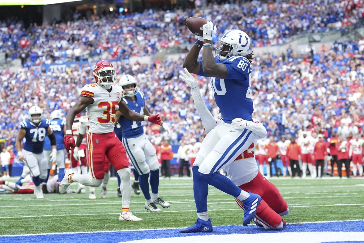 Indianapolis Colts tight end Jelani Woods (80) makes a touchdown reception against Kansas City Chiefs' Juan Thornhill during the second half of an NFL football game, Sunday, Sept. 25, 2022, in Indianapolis.