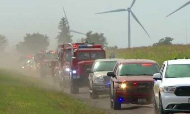 Dozens of fire trucks and emergency vehicles rolled through New Sharon Thursday to honor Gary DeCook