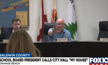 Orange Beach School Board President Robert Stuart calls city hall "my house" during a school board meeting Thursday night.