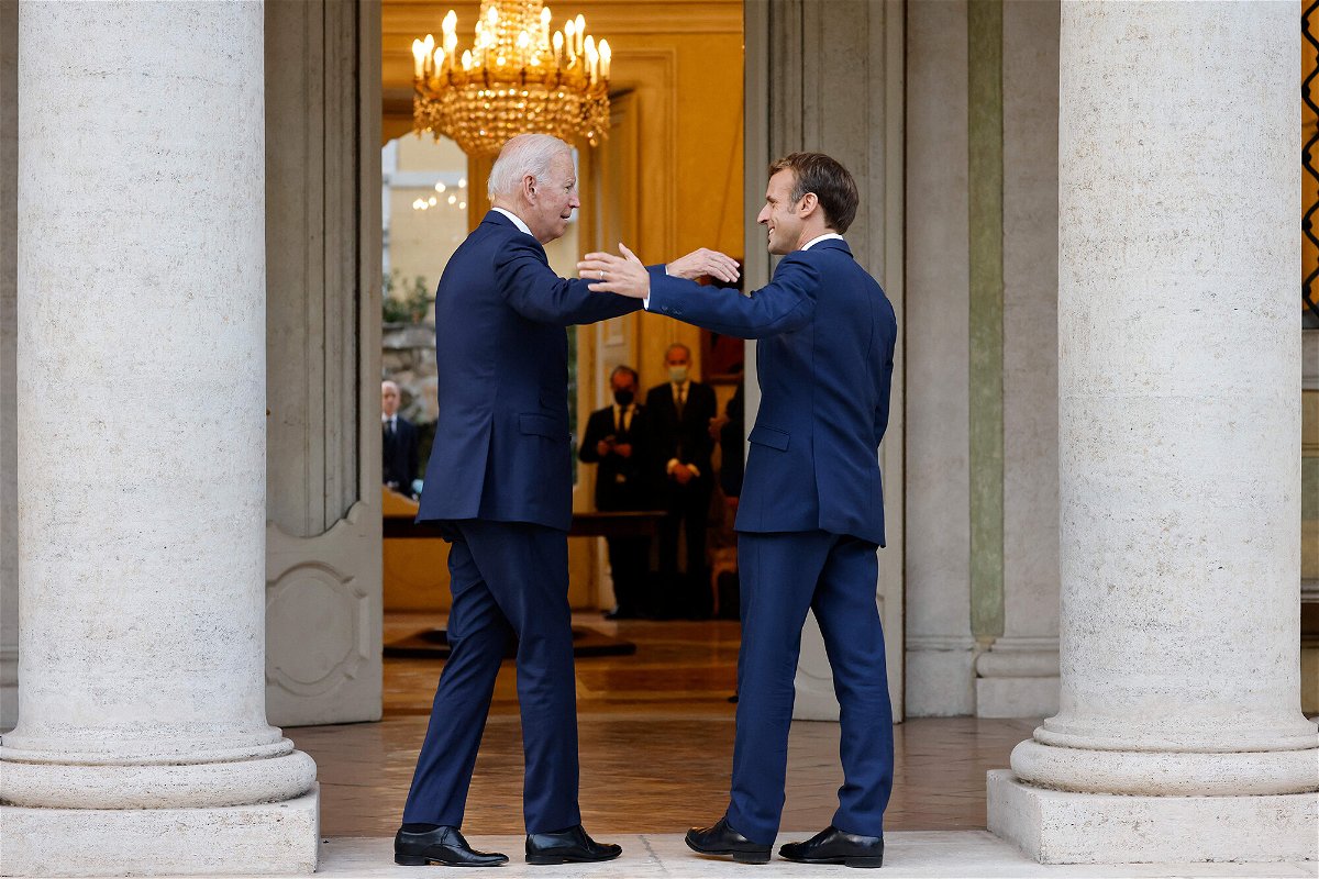 <i>Ludovic Marin/AFP/Getty Images</i><br/>President Joe Biden (left) is scheduled to host his first state dinner at the White House for French President Emmanuel Macron on December 1. President Macron is pictured here greeting President Biden in Rome in October of 2021.