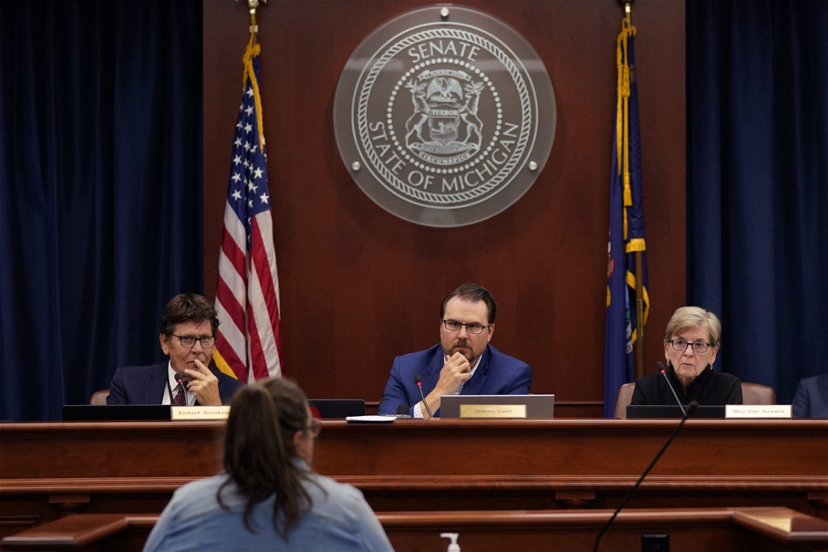 <i>Carlos Osorio/AP</i><br/>Members of the Michigan State Board of Canvassers are seen here on August 31 in Lansing