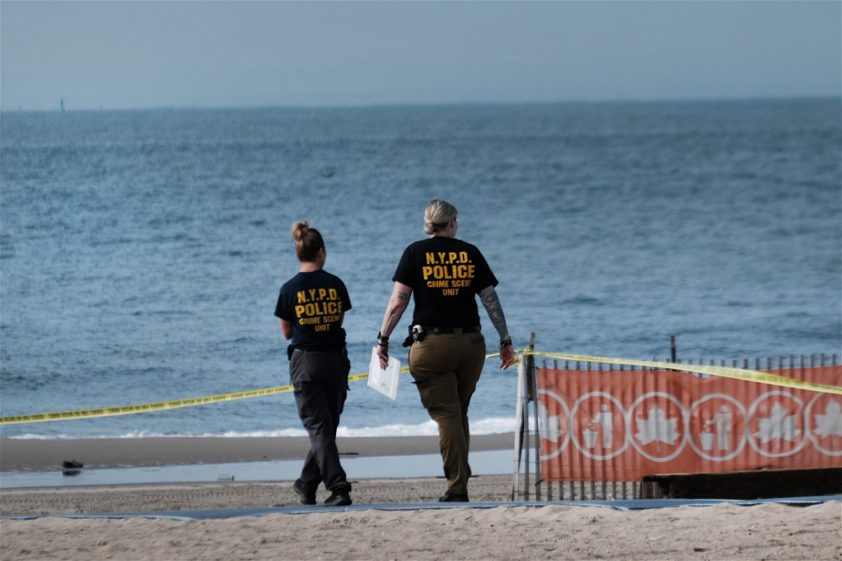 <i>Spencer Platt/Getty Images</i><br/>Police work along a stretch of beach at Coney Island