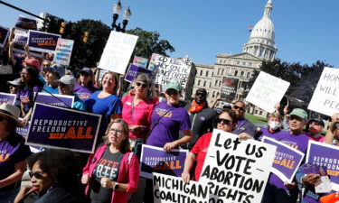 Pro choice supporters gather outside the Michigan State Capitol during a "Restore Roe" rally in Lansing