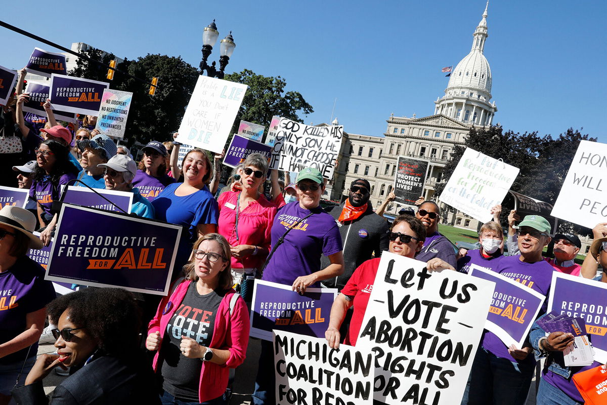 <i>Jeff Kowalsky/AFP/Getty Images</i><br/>Pro choice supporters gather outside the Michigan State Capitol during a 