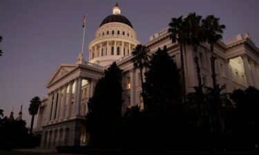The lights of the California state Capitol glow into the night in Sacramento on August 31. California passed a 'historic' legislative package protecting or expanding abortion access.