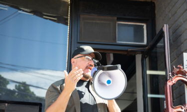 Oath Keeper leader Stewart Rhodes speaks at the Casa Di Dolore tattoo shop in Newburgh