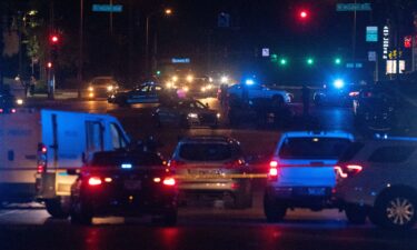 Memphis police officers work the scene of a shooting MPD believes was committed by a man driving around shooting on September 7.