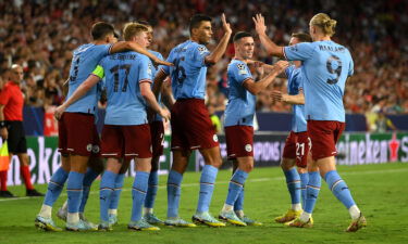 Manchester City players celebrate their second goal against Sevilla.