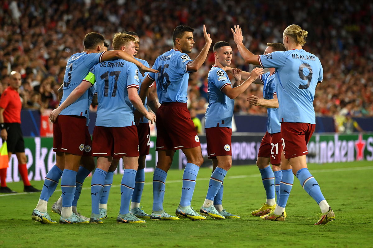 <i>David Ramos/Getty Images Europe/Getty Images</i><br/>Manchester City players celebrate their second goal against Sevilla.