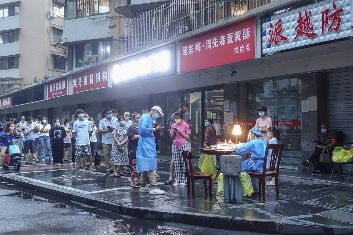 <i>EPA-EFE/Shutterstock</i><br/>People line up for a Covid-19 test in Chengdu