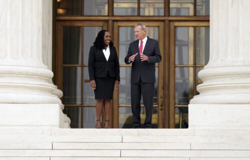 Justice Ketanji Brown Jackson (left) stands outside the Supreme Court with Chief Justice John Roberts following her formal investiture ceremony on September 30.