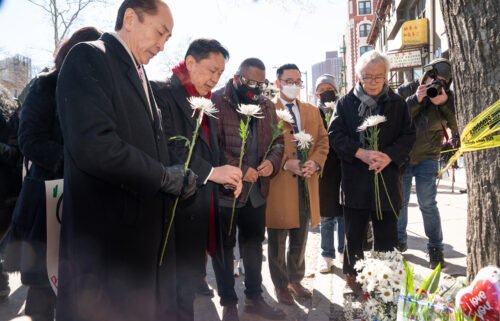 Asian American community leaders place flowers on a memorial for murder victim Christina Yuna Lee after an anti-Asian hate rally in New York City on February 15.