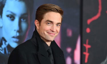 English actor Robert Pattinson arrives for "The Batman" world premiere in March. He will curate an upcoming art auction.