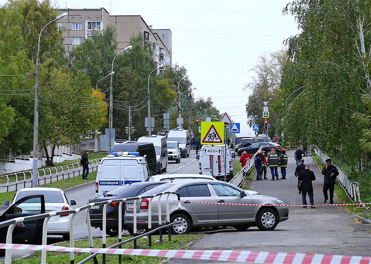 <i>Reuters</i><br/>Police and emergency service workers are pictured here near the scene of the school shooting in Izhevsk