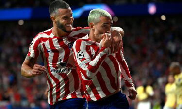 Antoine Griezmann (right) celebrates scoring against Porto.