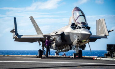 A Sailor fuels an F-35C Lightning II