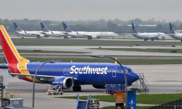 The pilot of a Southwest Airlines flight threatened to cancel takeoff after someone on the plane sent a naked photograph to other passengers. A Southwest Airlines Boeing 737 MAX 8 is pictured in Houston in March of 2019.