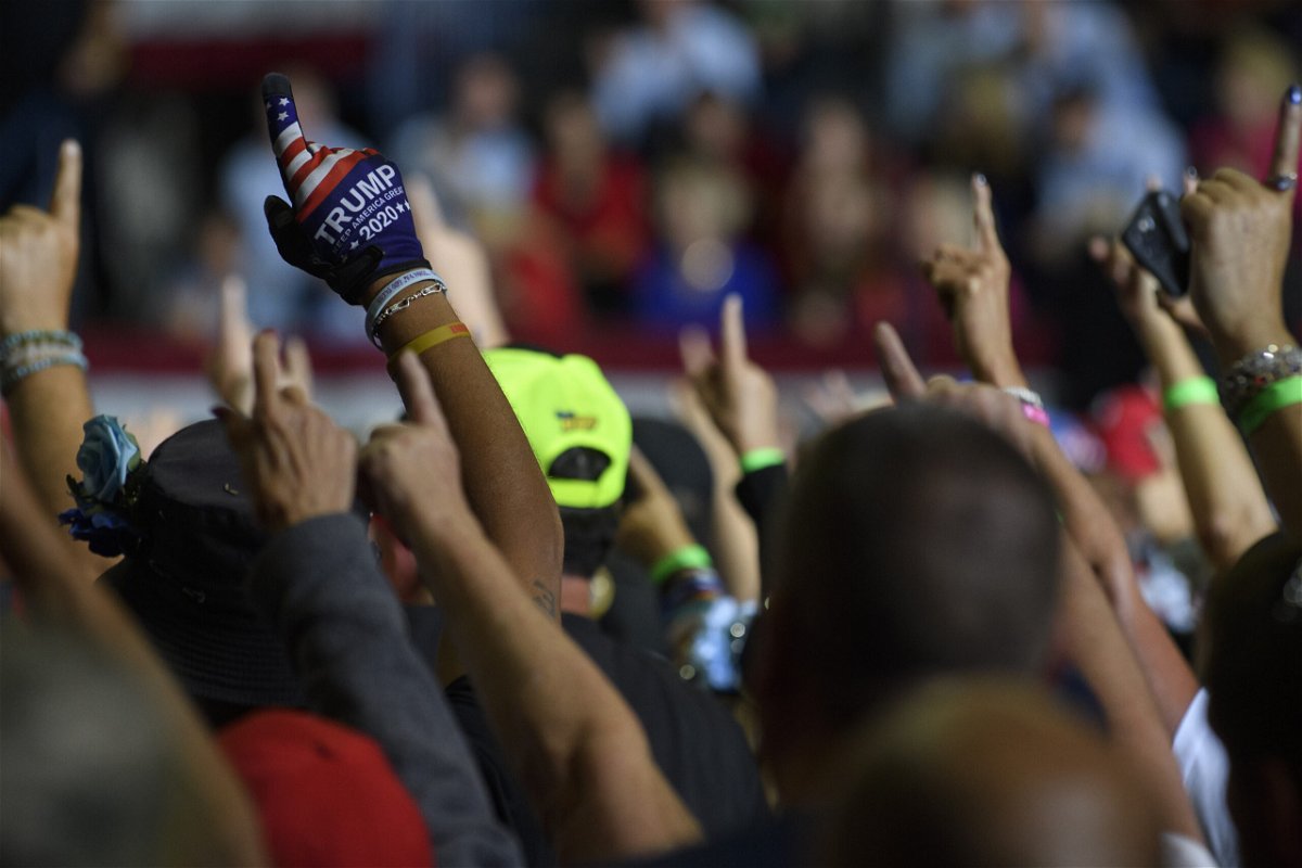 <i>Jeff Swensen/Getty Images</i><br/>Crowd members put their index fingers at Trump's Ohio rally. QAnon fans are celebrating Trump's latest embrace of the conspiracy theory.