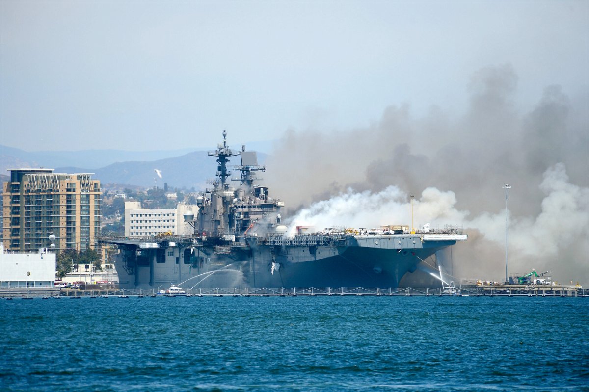 <i>Lt. John J. Mike/US Navy</i><br/>Port of San Diego Harbor Police Department boats combats a fire at Naval Base San Diego on July 12. A sailor charged in connection with starting a fire that destroyed a Navy warship while it was docked in San Diego has been found not guilty.