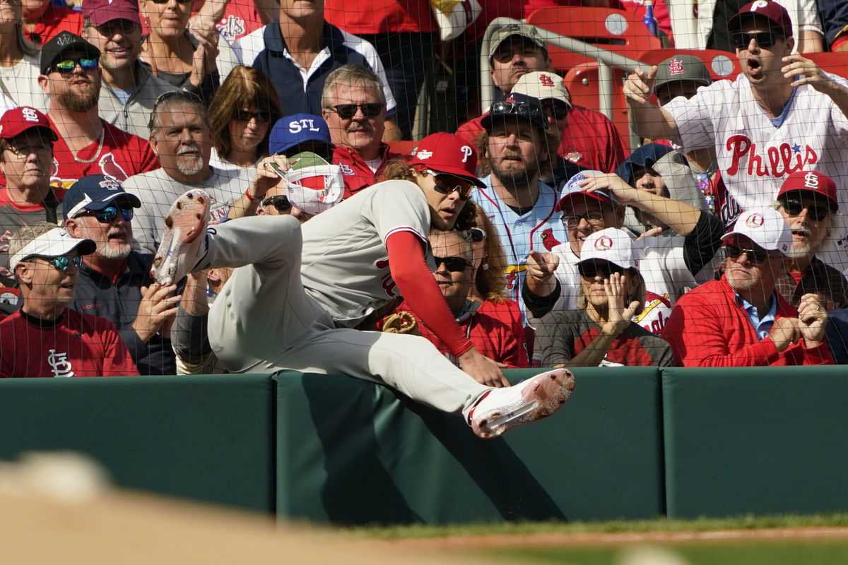 Philadelphia Phillies third baseman Alec Bohm makes a catch on a ball hit by St. Louis Cardinals' Lars Nootbaar during the third inning in Game 1 of a National League wild card baseball playoff series, Friday, Oct. 7, 2022, in St. Louis. (AP Photo/Jeff Roberson)