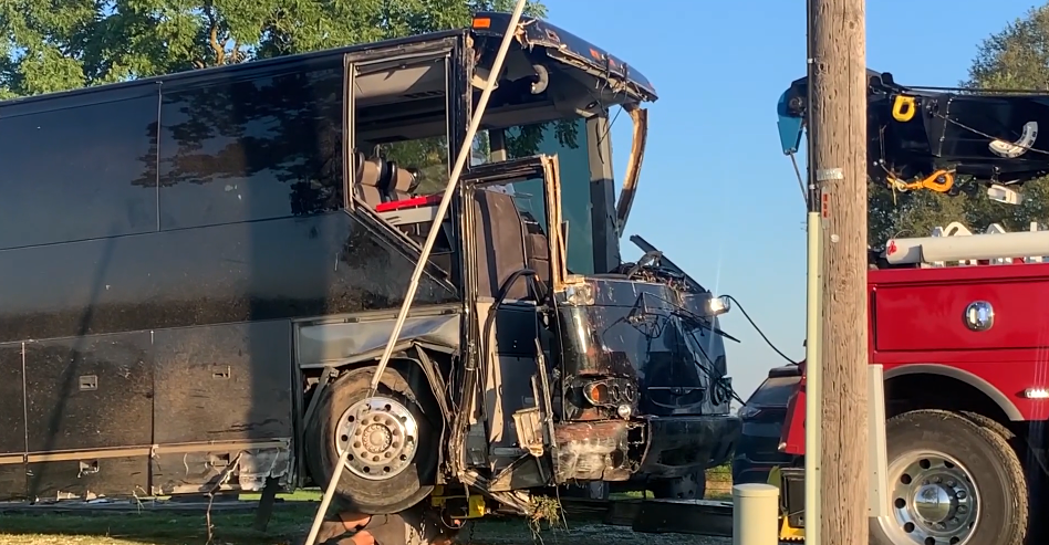 FILE- A damaged bus is towed away after a crash on July 14, 2022 in Cole County. 