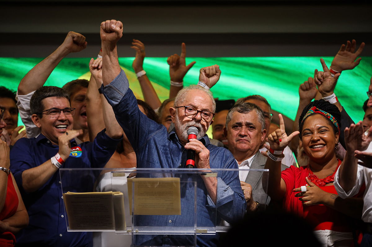 <i>Danilo Martins Yoshioka/Anadolu Agency/Getty Images</i><br/>Luiz Inacio Lula da Silva (center) speaks after the announcement that he had won the election on October 31.