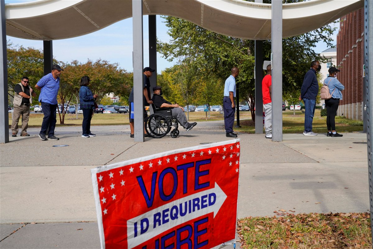 <i>Cheney Orr/Reuters</i><br/>A line of early voters stretches outside the building as early voting begins for the midterm elections in Columbus