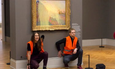 Climate protesters from the group Last Generation after throwing mashed potatoes at Monet's "Haystacks" at Potsdam's Barberini Museum on October 24.