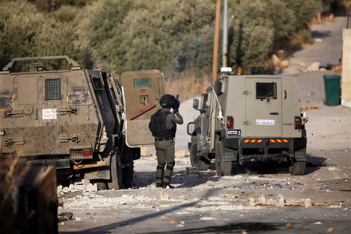 <i>Nasser Ishtayeh/SOPA Images/Zuma Press</i><br/>Palestinian youths and Israeli forces clash as troops surround a building in the village of Deir al-Hatab. A Palestinian man was killed and two journalists shot and injured by Israeli forces during an Israeli military raid on October 5.