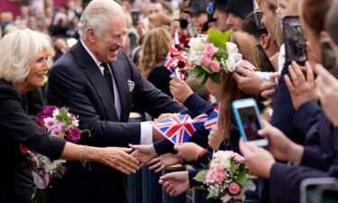 King Charles III and Queen Consort Camilla greet well-wishers as they arrive at Hillsborough Castle in Belfast on September 13.
