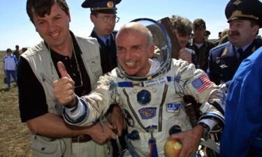 US millionaire Dennis Tito celebrates after landing near the Kazakh town of Arkalyk following his trip as the world's first space tourist in 2001. SpaceX said on October 12 that it has booked yet another mission around the moon for a wealthy thrill-seeker