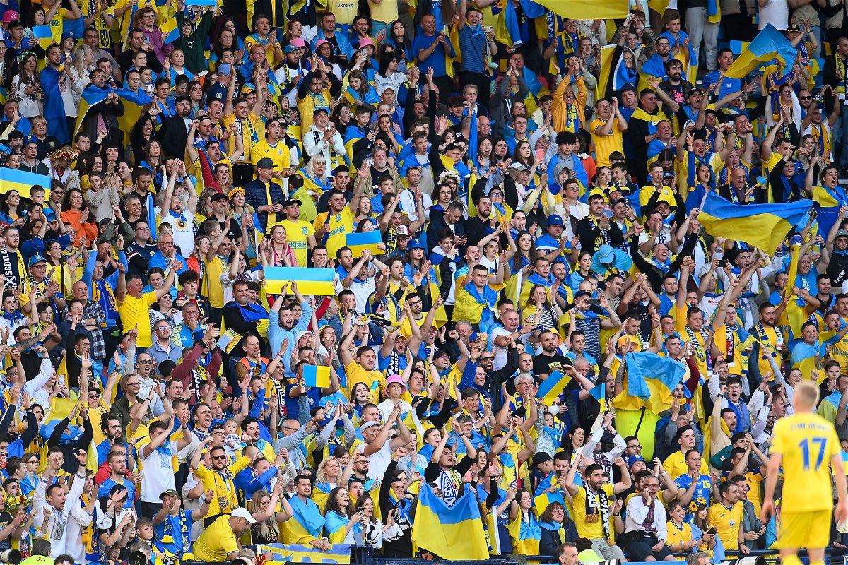 <i>Malcolm Mackenzie/PA Images/Getty Images</i><br/>Ukraine has joined Spain and Portugal's bid to host the 2030 World Cup. The Ukrainian crowd is pictured here during the FIFA World Cup 2022 Qualifier playoff semifinal match at Hampden Park