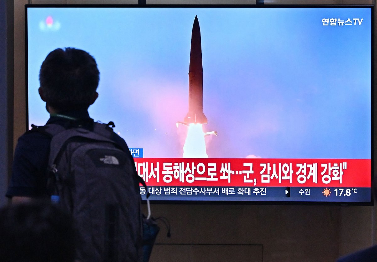 <i>Jung Yeon-je/AFP/Getty Images</i><br/>A man walks past a television screen showing a news broadcast with file footage of a North Korean missile test