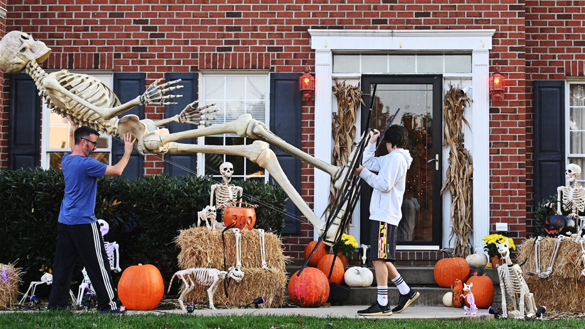 <i>Marvin Joseph/The Washington Post/Getty Images</i><br/>How a 12-foot skeleton became the hottest Halloween decoration around. A Maryland family is seen here breaking out their Home Depot skeleton