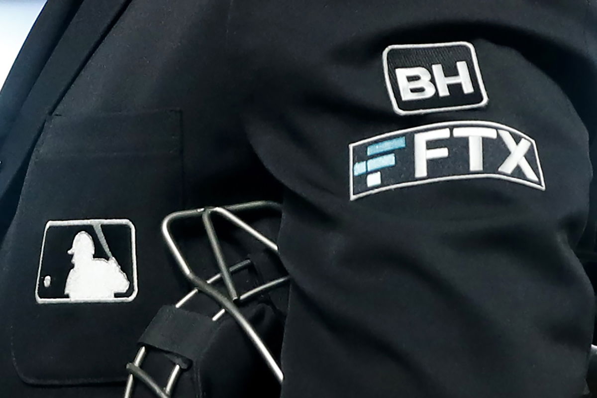 File - The FTX logo appears on home plate umpire Jansen Visconti's jacket at a baseball game with the Minnesota Twins on Tuesday, Sept. 27, 2022, in Minneapolis. Embattled cryptocurrency exchange FTX, short billions of dollars, is seeking bankruptcy protection, Friday, Nov. 11,  following its collapse this week.  