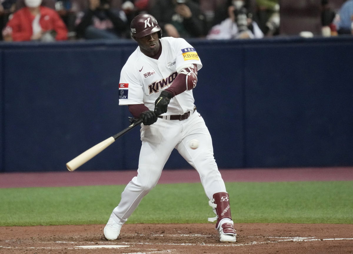 FILE - Former baseball outfielder Yasiel Puig of Kiwoom Heroes hits a ball during the opening game of the 2022 regular season for the Korea Baseball Organization in Seoul, April 2, 2022. Authorities Puig will plead guilty to lying to federal agents investigating an illegal sports gambling operation. The U.S. Department of Justice announced Monday, Nov. 14, 2022, that Puig acknowledged in unsealed court documents that he denied betting on the operation when in fact he made hundreds of bets in 2019. 