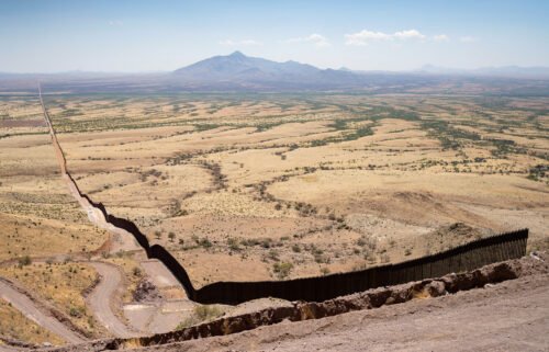 The US-Mexico border fence sprawls back into space in Cochise County south of Sierra Vista