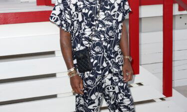 Pharrell Williams attends the Chanel Cruise show.