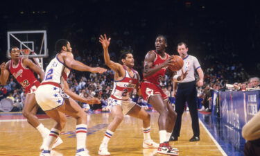 Chicago Bulls Michael Jordan (23) in action vs Washington Bullets Jeff Malone (24) at Capital Centre. Jordan wearing red Nike Air Jordan 1 sneakers.