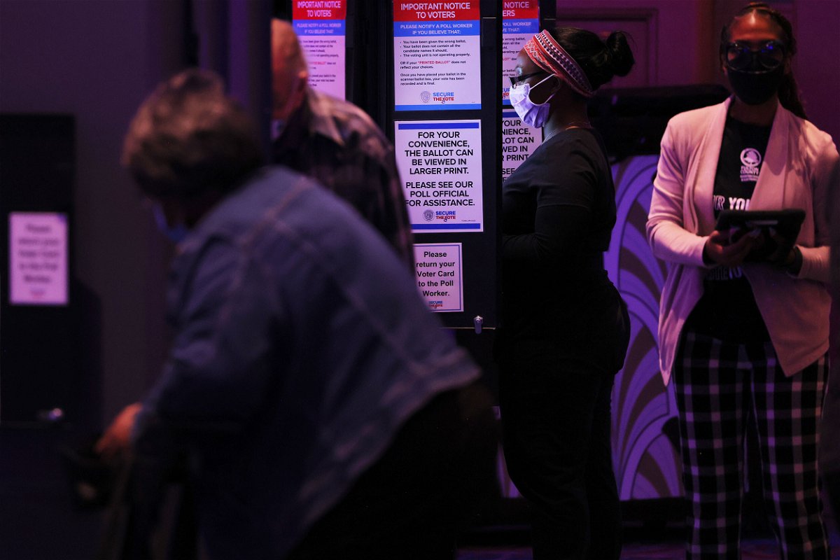 <i>Michael M. Santiago/Getty Images</i><br/>People cast their ballot during the Midterm Elections at Fox Theatre on November 8 in Atlanta
