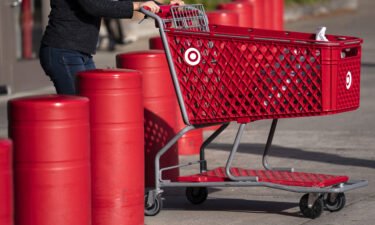 A customer pushes a shopping cart outside a Target store in Hyattsville