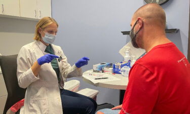 Hy-Vee pharmacist Carley Start administers a flu shot to Rick DeBruin at the Hy-Vee Westlakes location in West Des Moines on September 21. Flu season continues to intensify in the US