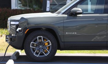 A Rivian electric pickup truck sits in a parking lot at a Rivian service center on May 9 in South San Francisco