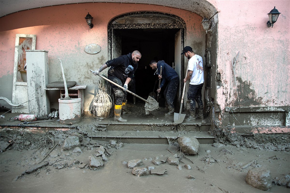 <i>Ivan Romano/Getty Images</i><br/>Volunteers cleaned up the mud after the landslide that hit the town of Casamicciola Terme.