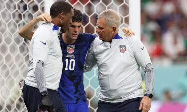 Christian Pulisic is helped off the field on November 29.